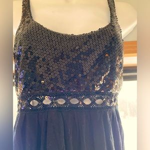 Say what? Cute black dress. Medium. Peek a boo holes under the bust.